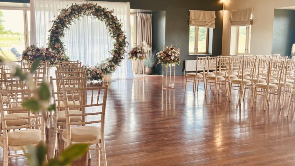 Outdoor ceremony overlooking the lake at Mill Green