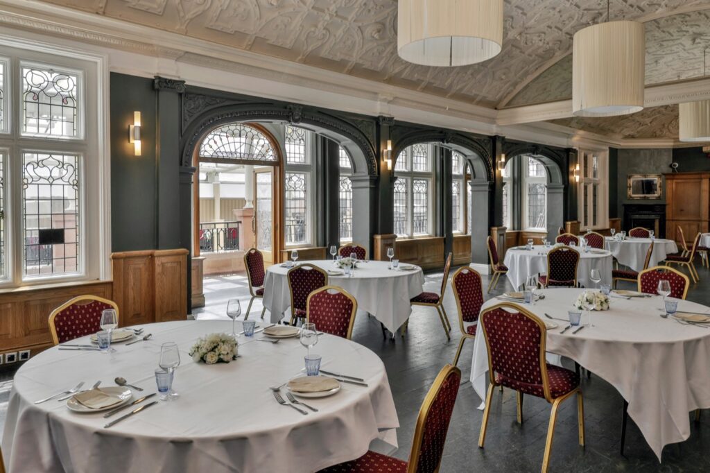 The Sala Room set for a formal dinner beneath period architecture at La Royale, Cricklewood